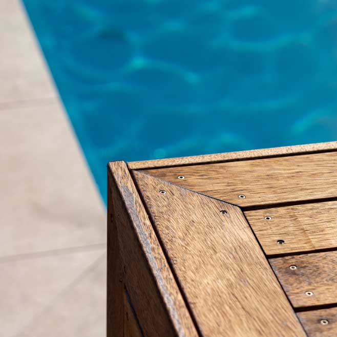 Closeup of fine decking construction next to pool